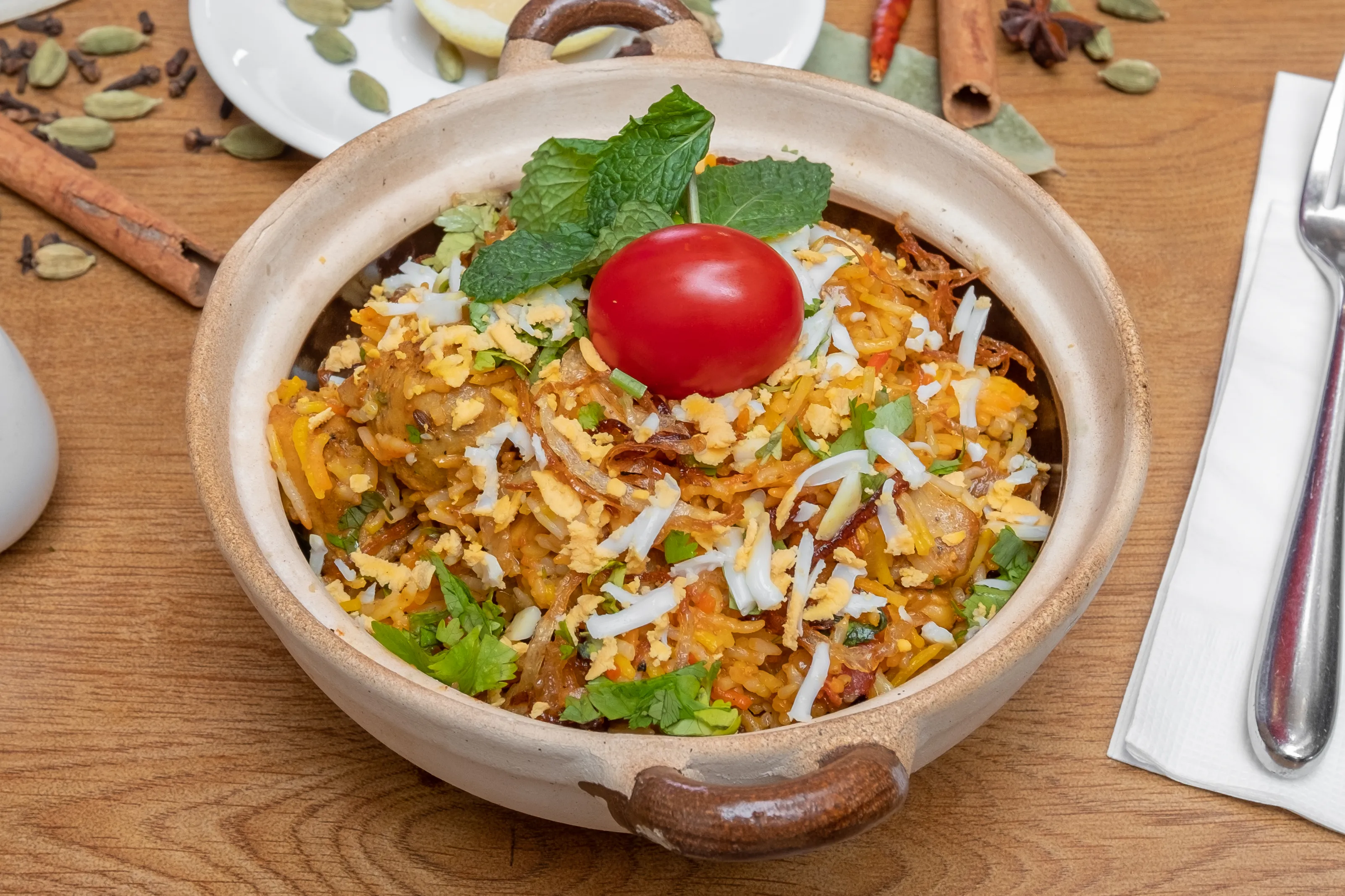A claypot biryani at Papa Gomes, the pastry seal opened at the table
